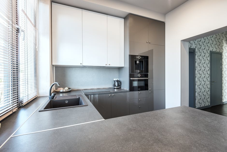 Stylish and sleek modern kitchen interior with high-gloss cabinetry and minimalist design.